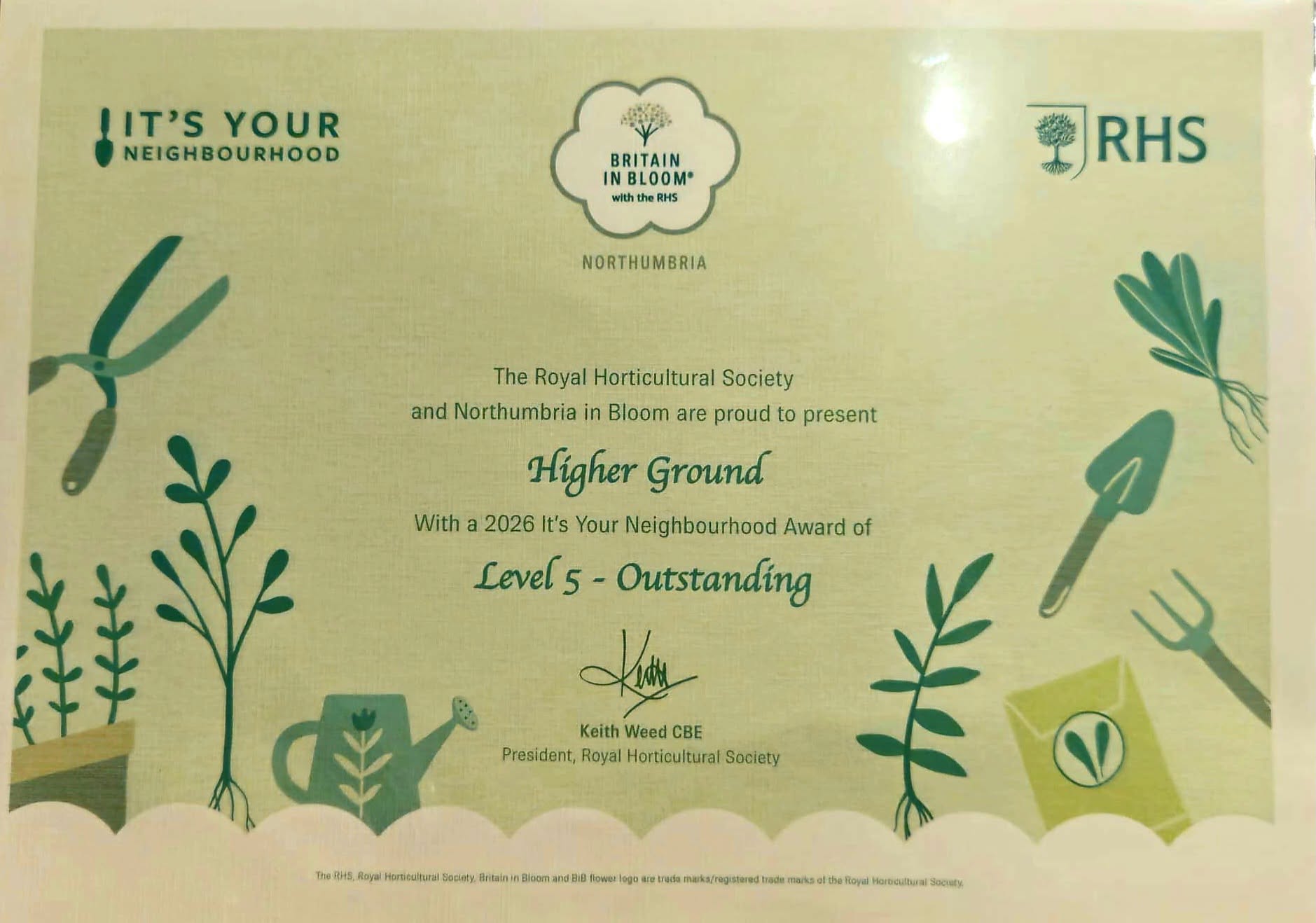 Certificate from Britain in Bloom with the RHS. Northumbria. The Royal Horticultural Society and Northumbria in Bloom are proud to present Higher Ground With a 2026 It's Your Neighbourhood Award of Level 5 - Outstanding. Signed Keith Weed CBE, Royal Horticultural Society